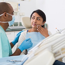 Dental patient consulting with dentist