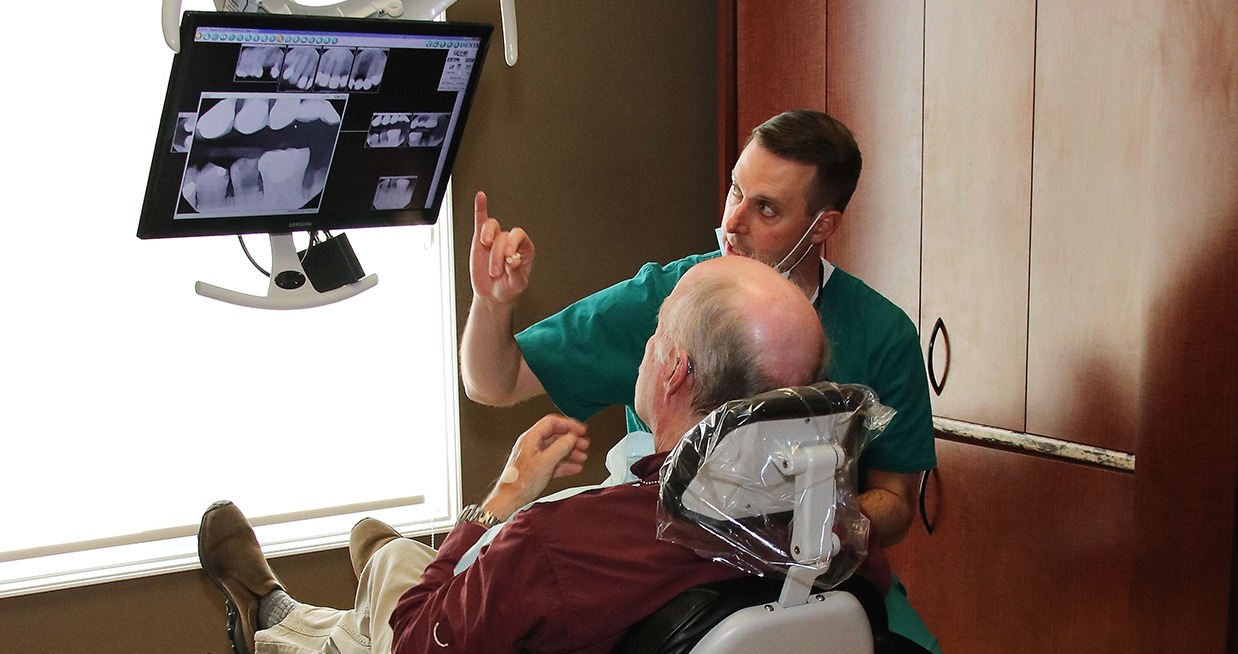 Louisville dentist showing a patient their x rays