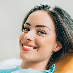 Woman with beautiful smile after dental bonding. 