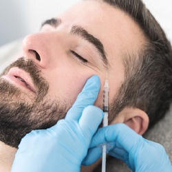 bearded man getting a BOTOX injection