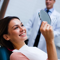 Woman smiling while visiting Louisville cosmetic dentist