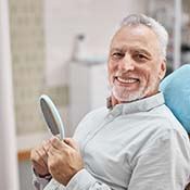 senior man sitting in the dental chair 