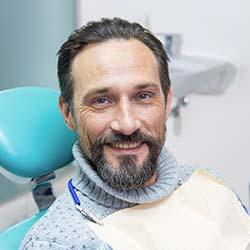 Man visiting Louisville emergency dentist for a checkup
