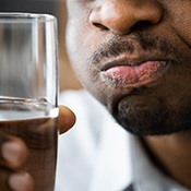 man rinsing mouth 