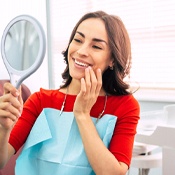 Woman with dental implants in Louisville smiling