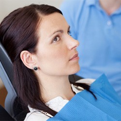 Concerned-looking female patient visiting the dentist