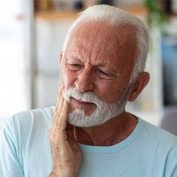 Senior bearded man at home with dental pain