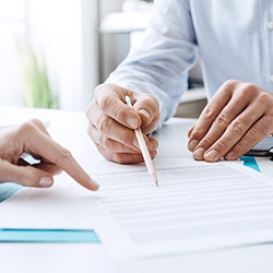 People reviewing dental insurance paperwork