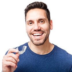 Man holding an Invisalign tray