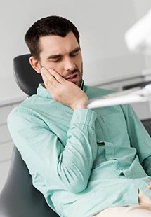 Male dental patient with pain in tooth