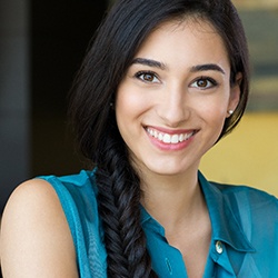 Woman with beautiful teeth after a smile makeover. 