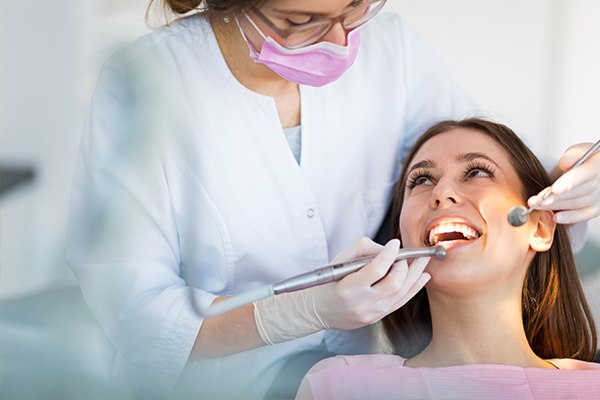 patient sitting in dental chair