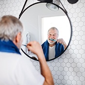 Man brushing this teeth
