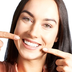 woman pointing to her teeth