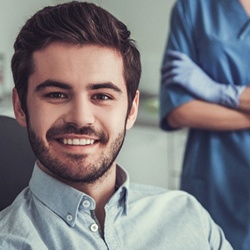 Man smiling after tooth extraction in Louisville 