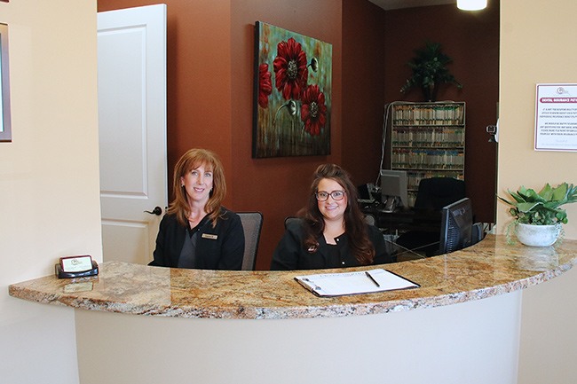 Bell Dental front desk workers smiling