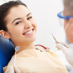 Woman smiling at the dentist’s office