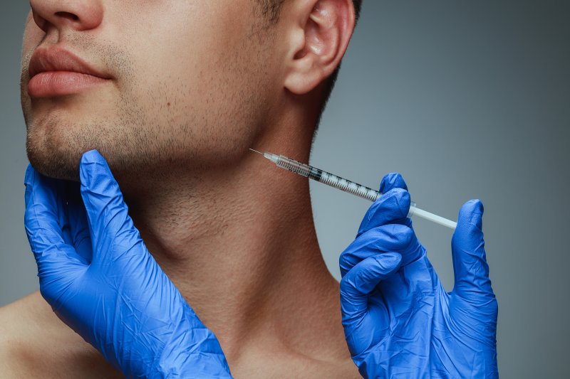 young man getting BOTOX injections