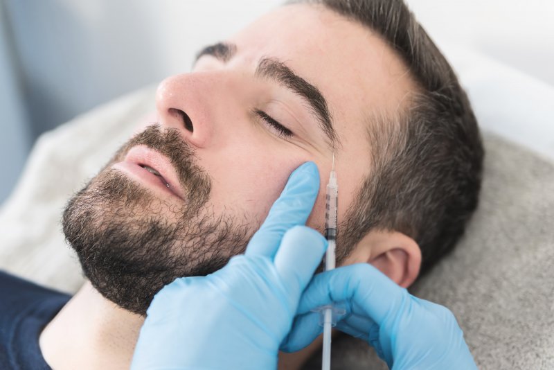 close up of a man getting a botox injection