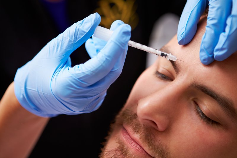 A man receiving BOTOX injections